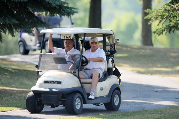 Mike Davison, of Monroe and Gene War, of Ann Arbor, move to the next hole Monday morning during the Judy Fike Annual Golf Outing "Tee it Up to Make a Difference for Ann Arbor Meals on Wheels!." Melanie Maxwell I AnnArbor.com